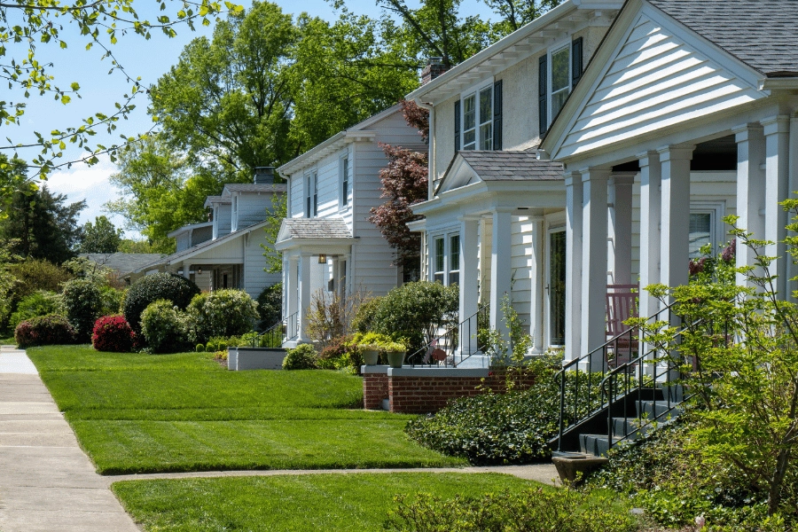 quiet suburban street lined with cute homes and well-maintained landscaping